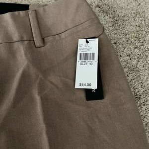 3 pairs of women’s dress pants. Dark brown, light brown, and grey. New with tags